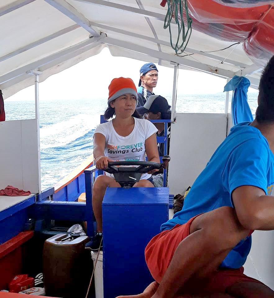 Gina Barquliia on a boat