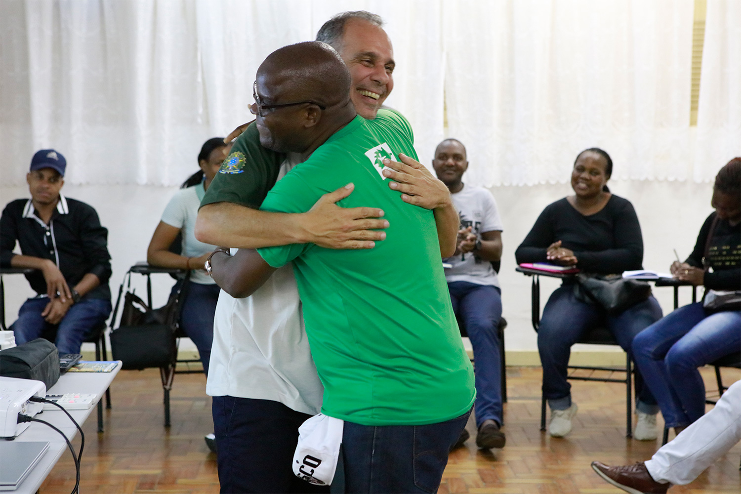 Mr. Leonardo Messias of ICMBio in Brazil and Mr. Joaquim Tembe of ADNAP in Mozambique embrace upon learning about each other’s experiences in marine conservation.