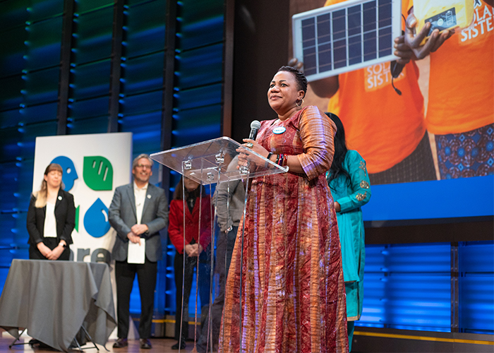 Fatma from Solar Sister acceptin Solution Search award