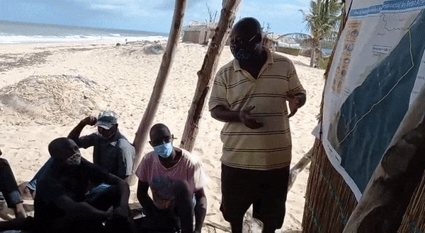 Gif of people speaking in Mozambique with masks on.