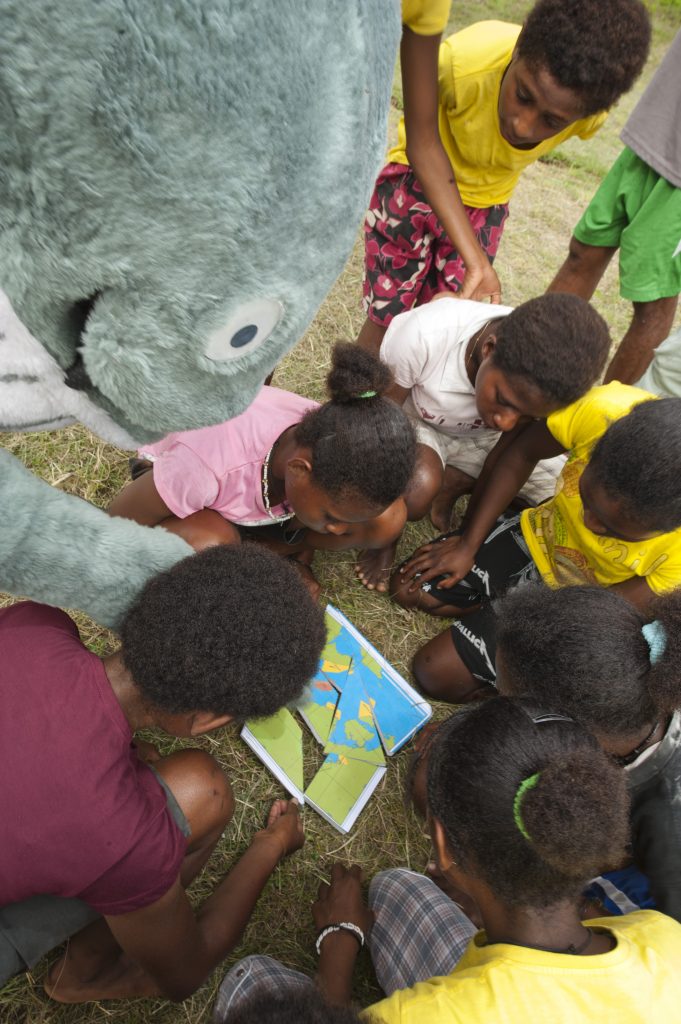 Mascot playing games with children in Bogor, Indonesia.