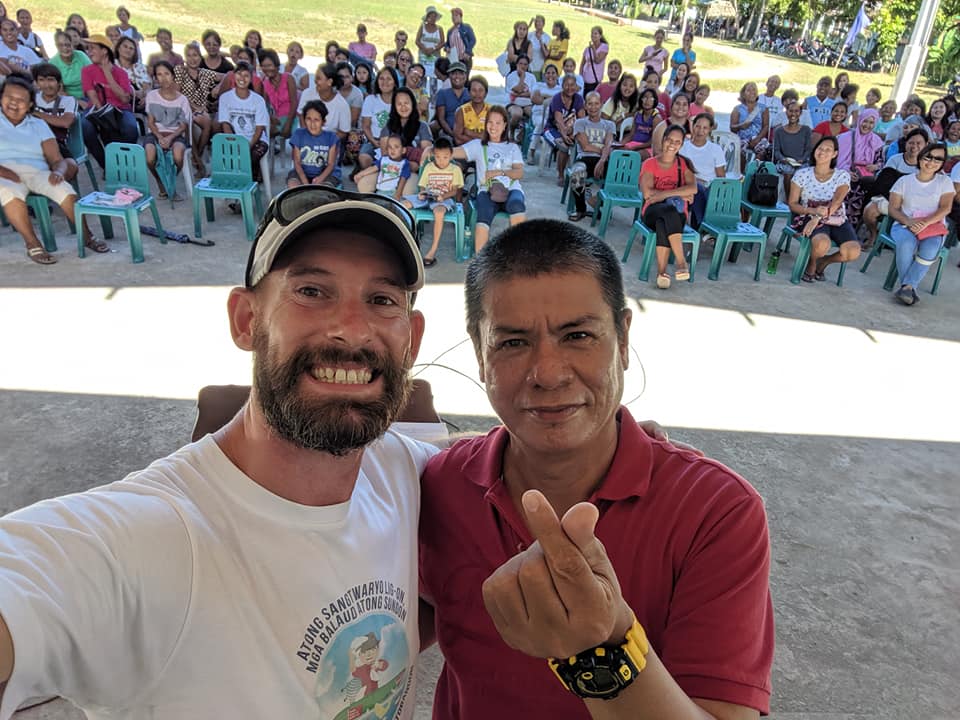 Scott McGuire hams it up with Principal Esmeraldo Pamaos at the Mahayahay Elementary School in Saint Bernard, Southern Leyte during an orientation on Proper Waste Disposal for students.