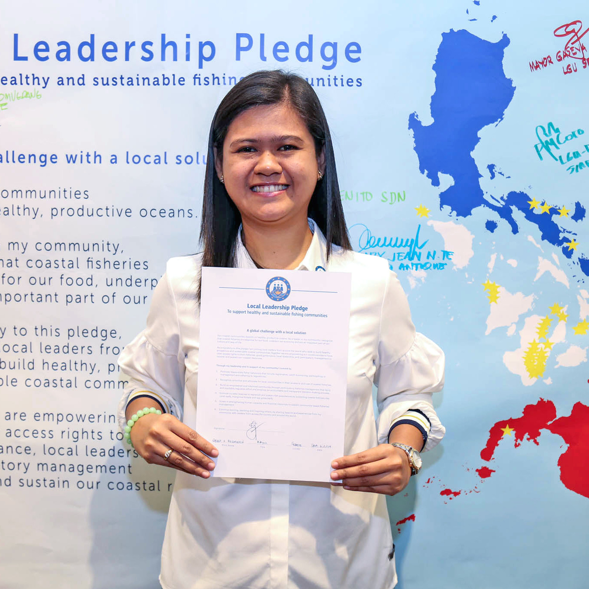 Mayor of Sebaste, Philippines, Gaseva Recopuerto with signed public pledge and pin.