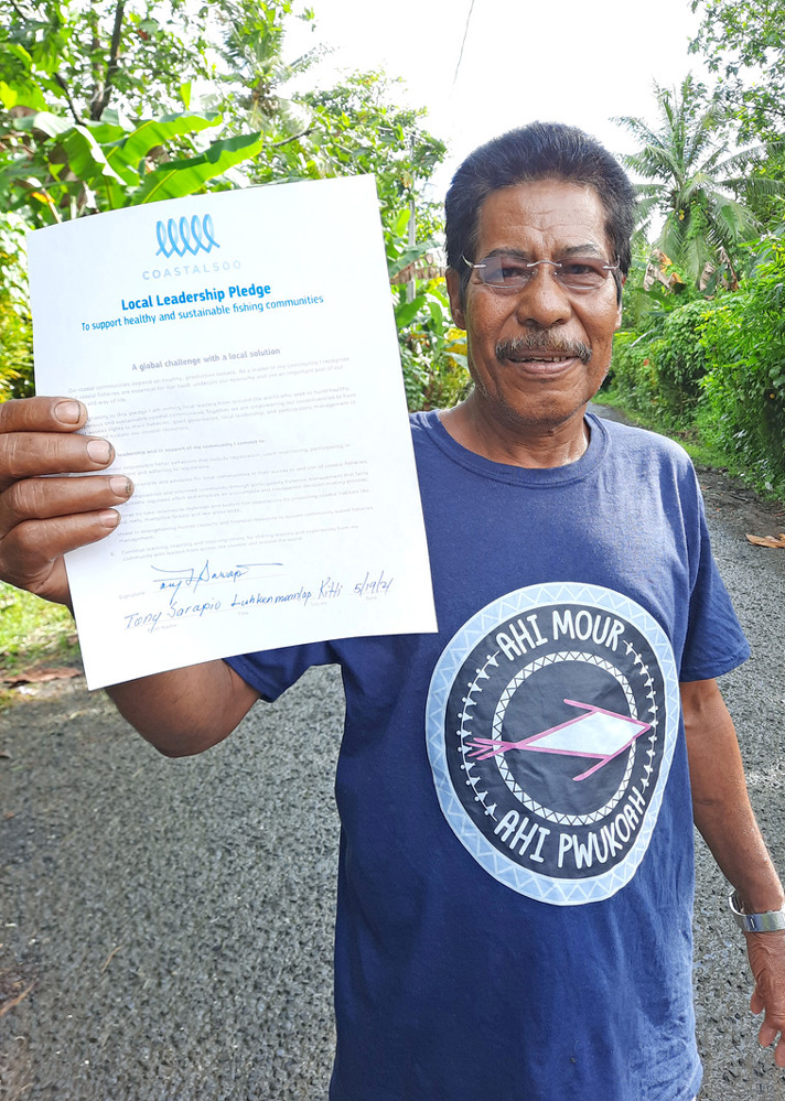 Mayor of Kitti (or Kiti), Pohnpei, Micronesia, with his signed Coastal 500 pledge.