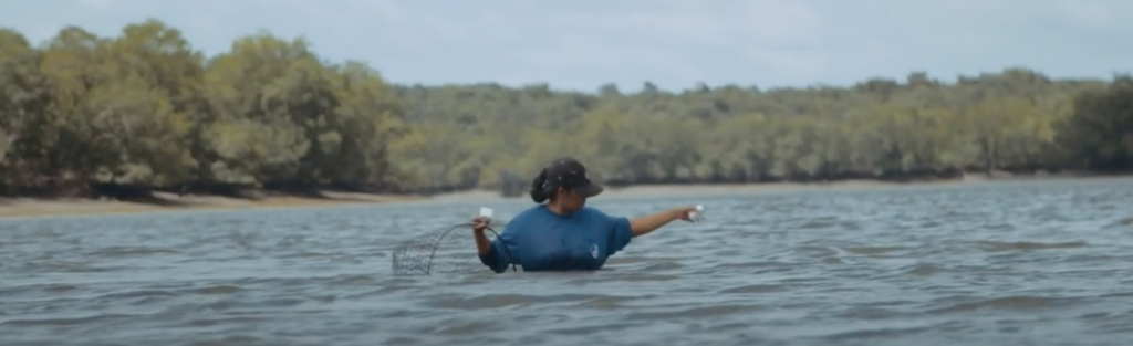 Woman in a mangrove in Brazil.