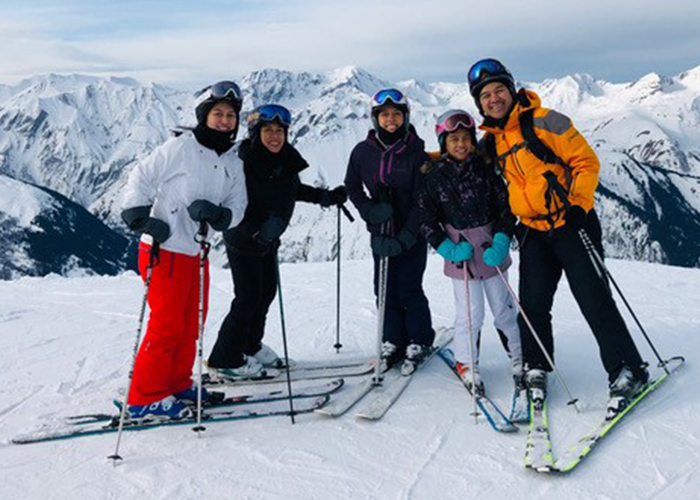 Carla Villacorta and her family skiing.