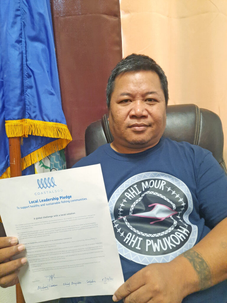 Mayor Sokehs of Pohnpei, Micronesia, with his signed Coastal 500 pledge.