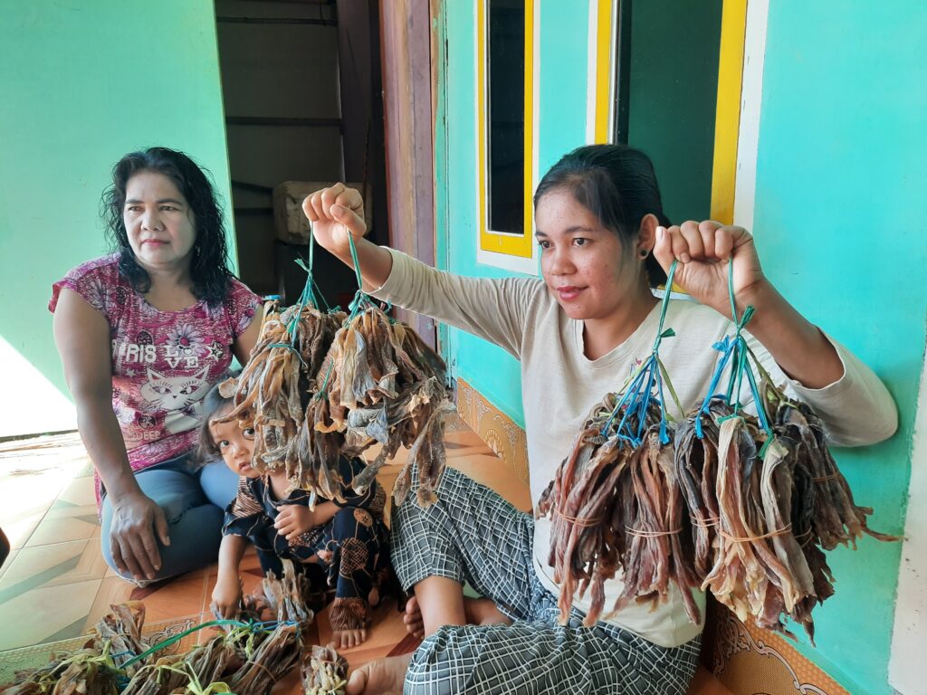 Fish processors in Southeast Sulawesi province show off their catch 