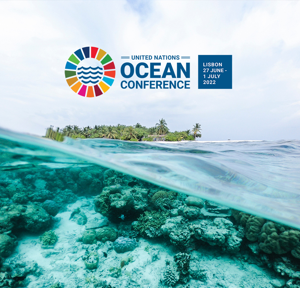 Half underwater photo in the Pacific Ocean with the UN Ocean Conference 2022 logo.