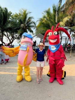 Lizanne Galbreath posing with mascots in Honduras.