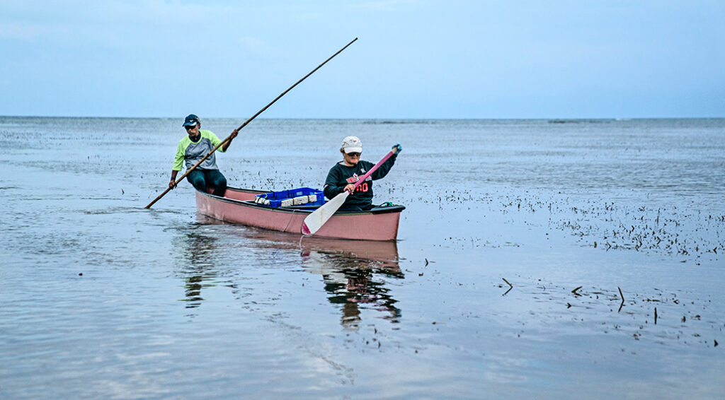 Fishers in a canoe in Palau.