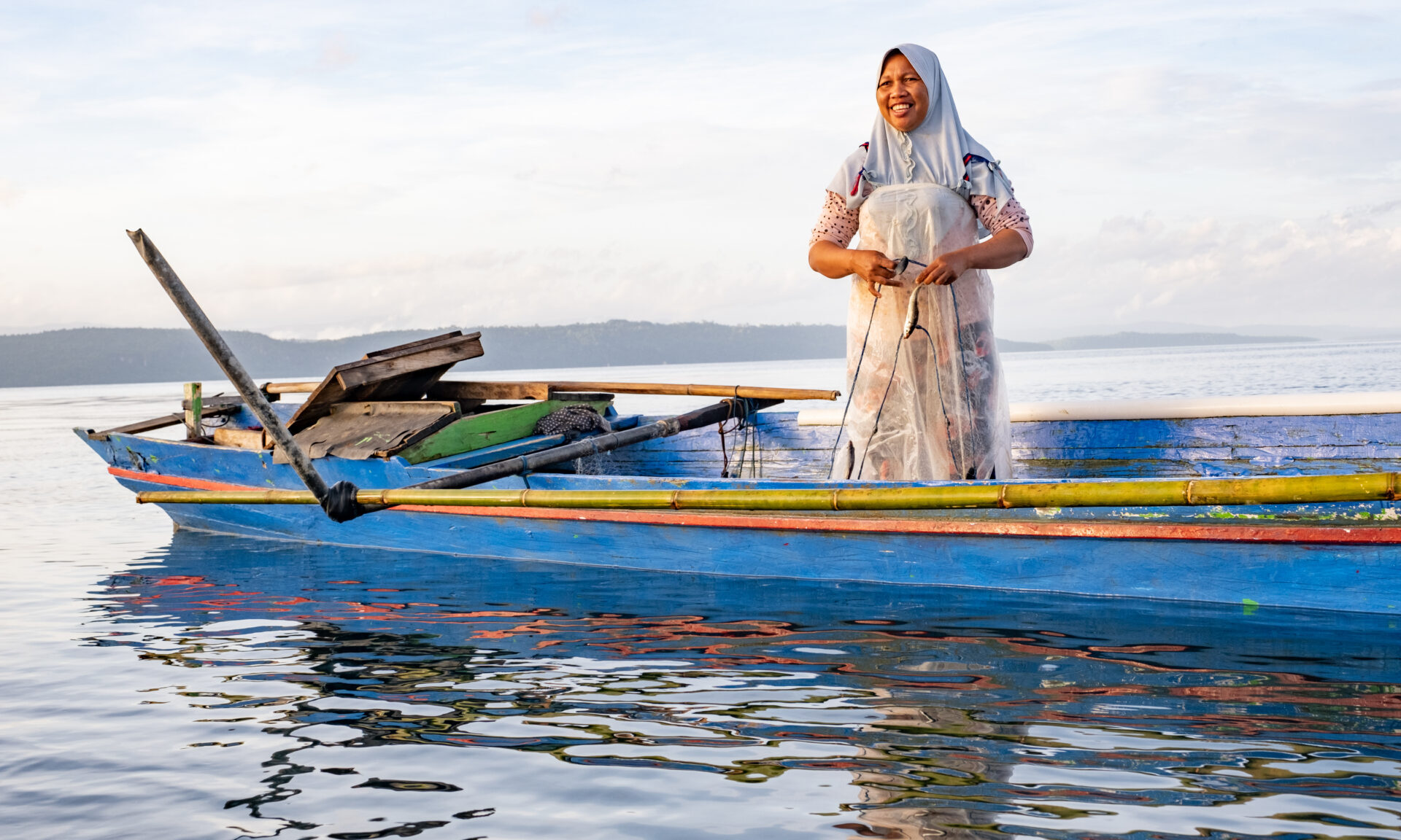 Photo of net fishing off the coast of their community, Pasi Kolaga.