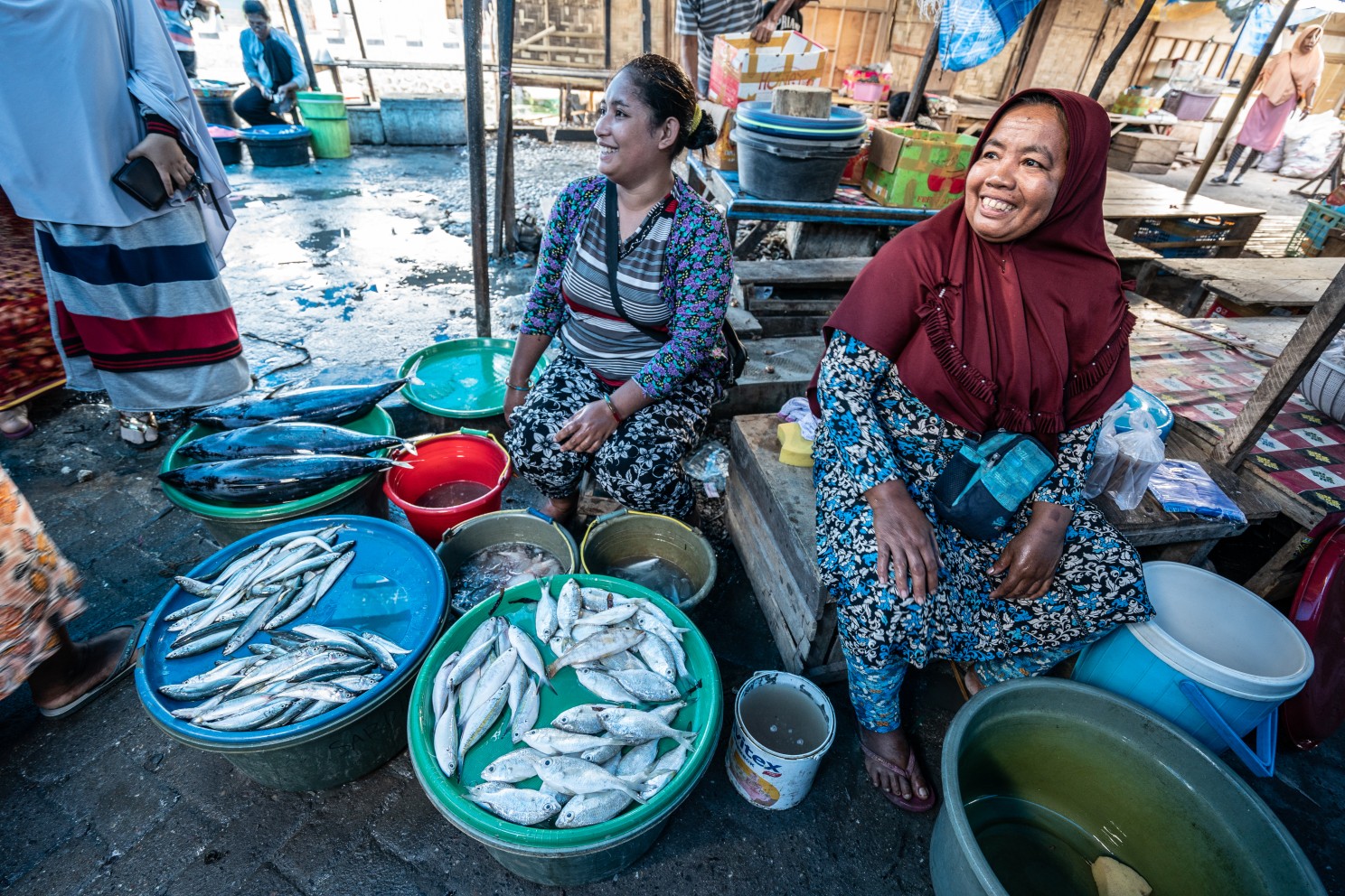 Women sell fish at the market in the Bajo Community in Wakatobi, Indonesia. 