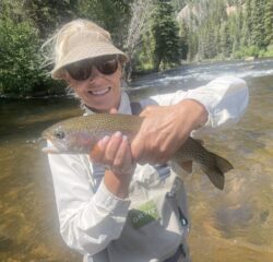 Photo of Amy Berg holding a fish.