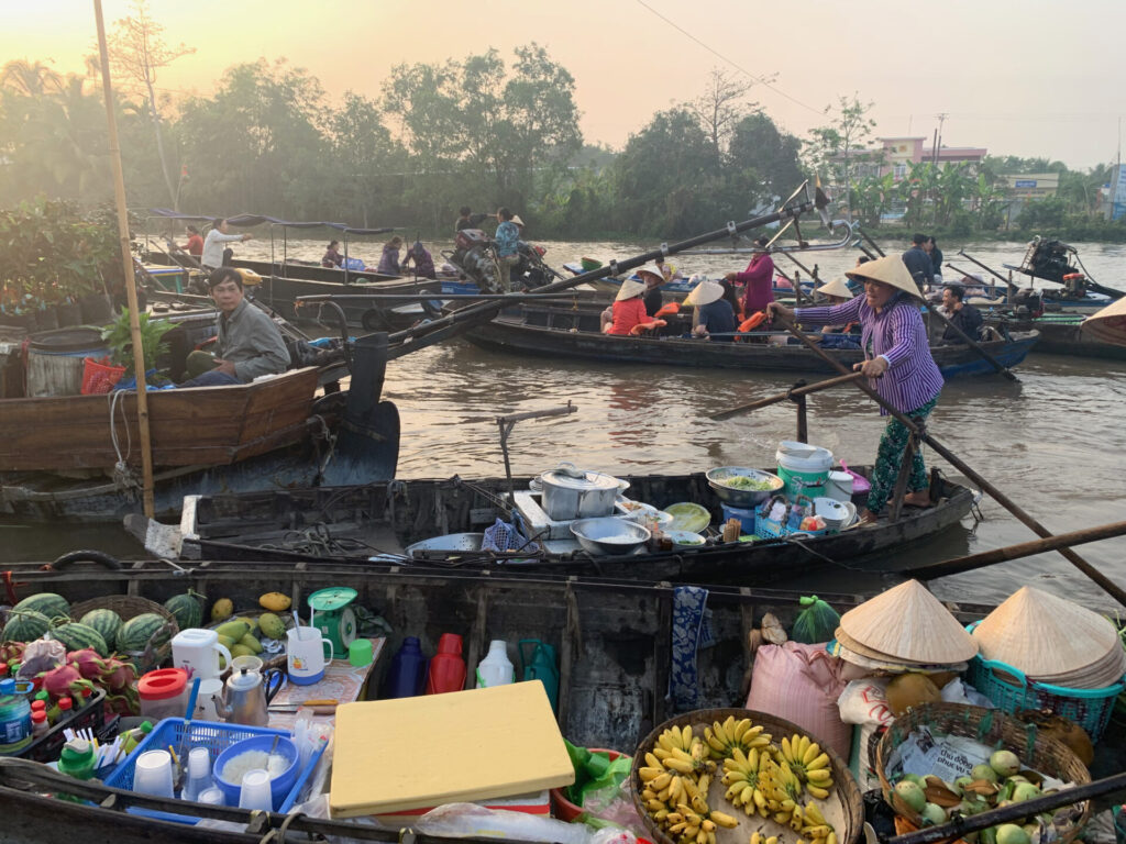 Fishers and famers on boats in Vietnam.