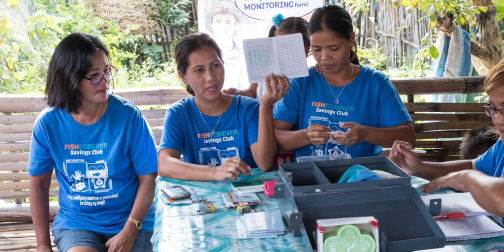 Women running a savings club in the Philippines.