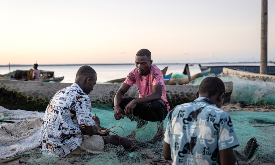 Community members playing the fish game at a Community Building Seminar hosted by Rare.