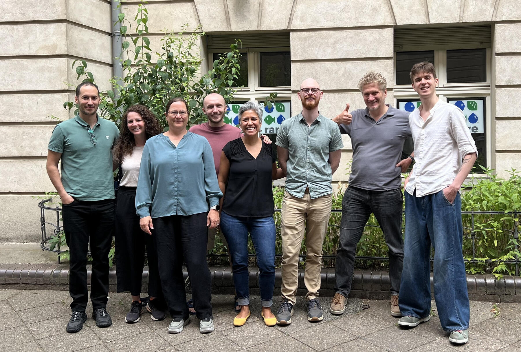 Staff standing in front of the Berlin office.